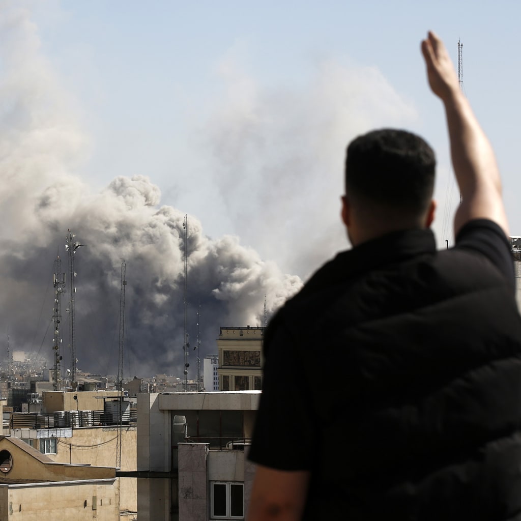 Plumes of smoke rise over the residential areas of the Iranian capital following airstrikes amid ongoing U.S.–Israel attacks as multiple explosions are heard across the city in Tehran.