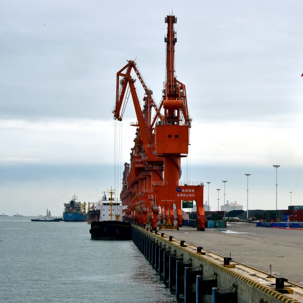 A Chinese national flag flies at a port in Beihai, Guangxi autonomous region, China June 17, 2017. Picture taken June 17, 2017. REUTERS/Stringer