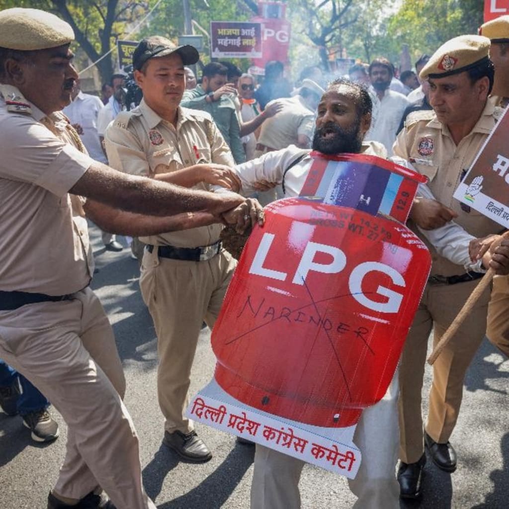 Police detain a supporter India’s main opposition Congress party on March 13, 2026, during a protest in New Delhi against price hikes and supply disruptions of liquified petroleum gas (LPG) cylinders following the U.S.-Israeli conflict.