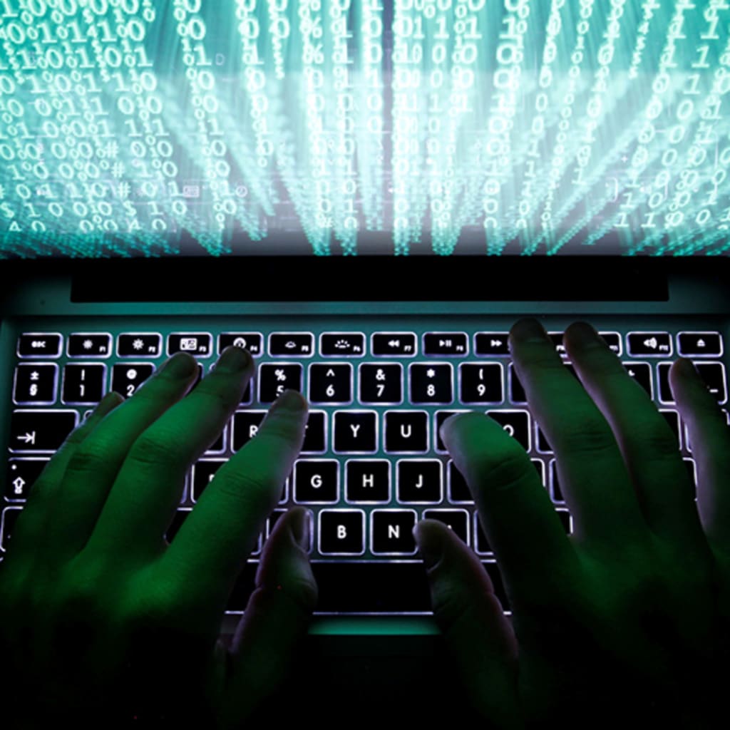 Man typing on computer