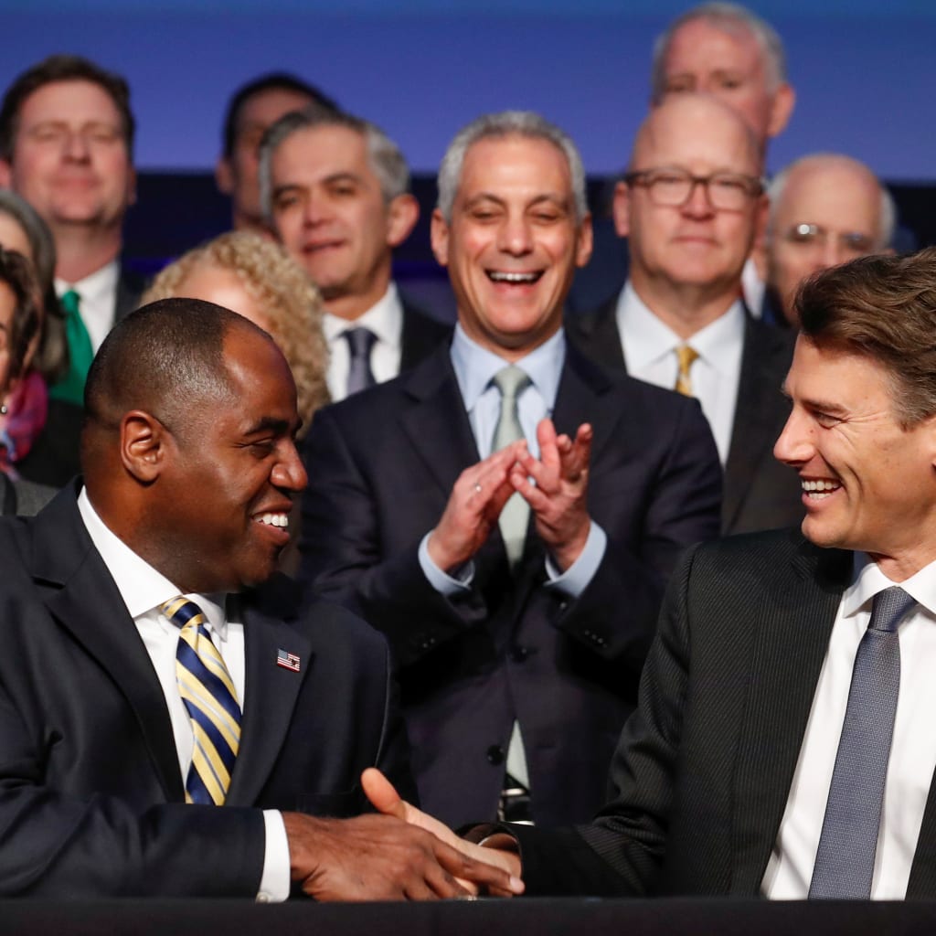 <p>Vancouver Mayor Gregor Robertson and Waukegan, Illinois Mayor Sam Cunningham shake hands after signing the Chicago Climate Charter, Chicago, Illinois, December 5, 2017.</p>
