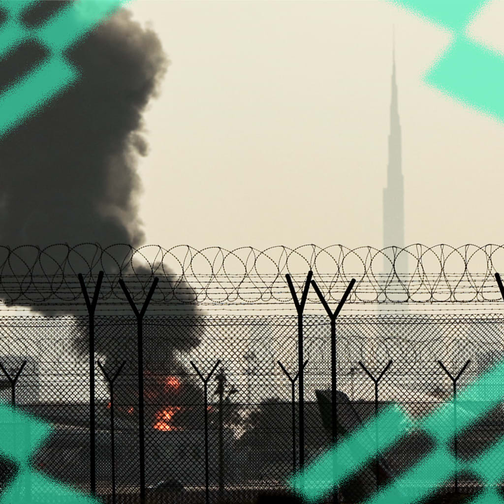 The Dubai skyline is pictured as a smoke plume rises from an ongoing fire near Dubai International Airport on March 16, 2026.