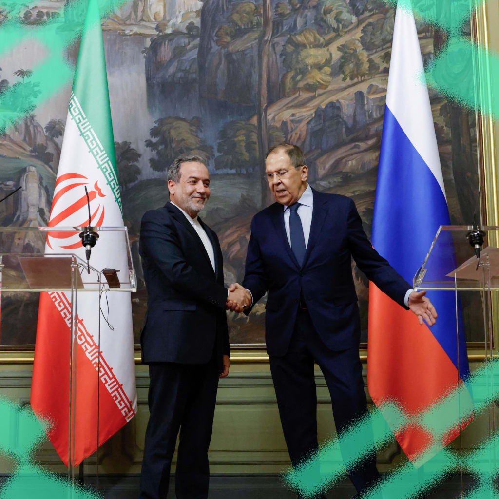 Russia's Foreign Minister Sergei Lavrov and Iran's Foreign Minister Abbas Araqchi shake hands during a press conference following their talks in Moscow, Russia on April 18, 2025.