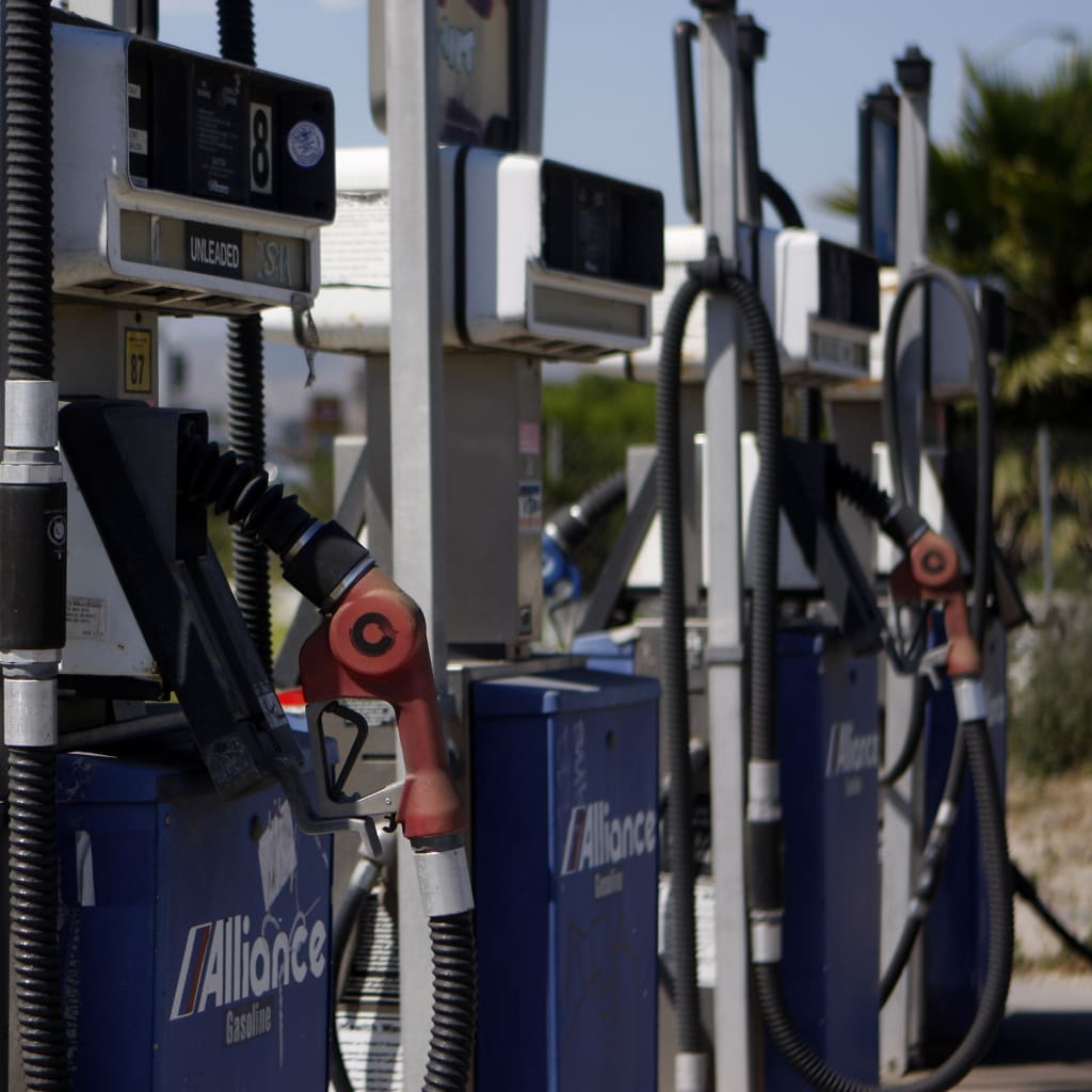 A close up image of gasoline pumps at a closed-down Alliance gas station in Ventura, California
