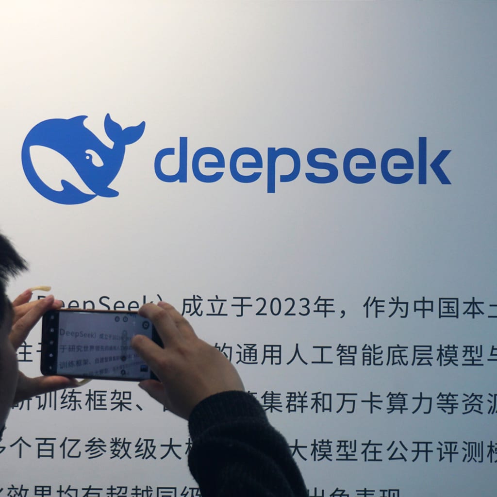 A visitor takes photos of the display board of DeepSeek at a mall on April 23, 2026 in Hangzhou, Zhejiang Province of China.