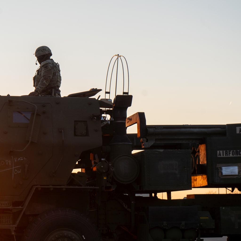 U.S. Army Staff Sgt. Zykee Allen, assigned to 3rd Battalion, 321st Field Artillery Regiment, sits atop an M142 High Mobility Artillery Rocket System (HIMARS) to receive a fire mission during a training mission at Ramstein Air Base, Germany, on March 27, 2025. 