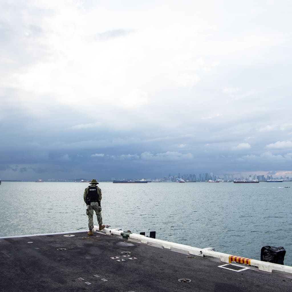 <p>Master-at-Arms third Class Elisha Francois stands watch as the Nimitz-class aircraft carrier transits the Strait of Malacca, December 28, 2024.</p>
