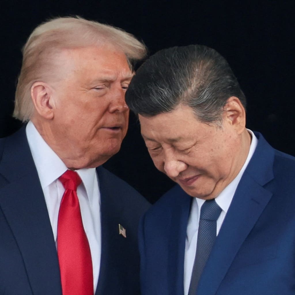 U.S. President Donald Trump and Chinese President Xi Jinping talk as they leave after a bilateral meeting at Gimhae International Airport, on the sidelines of the Asia-Pacific Economic Cooperation (APEC) summit, in Busan, South Korea, October 30, 2025.