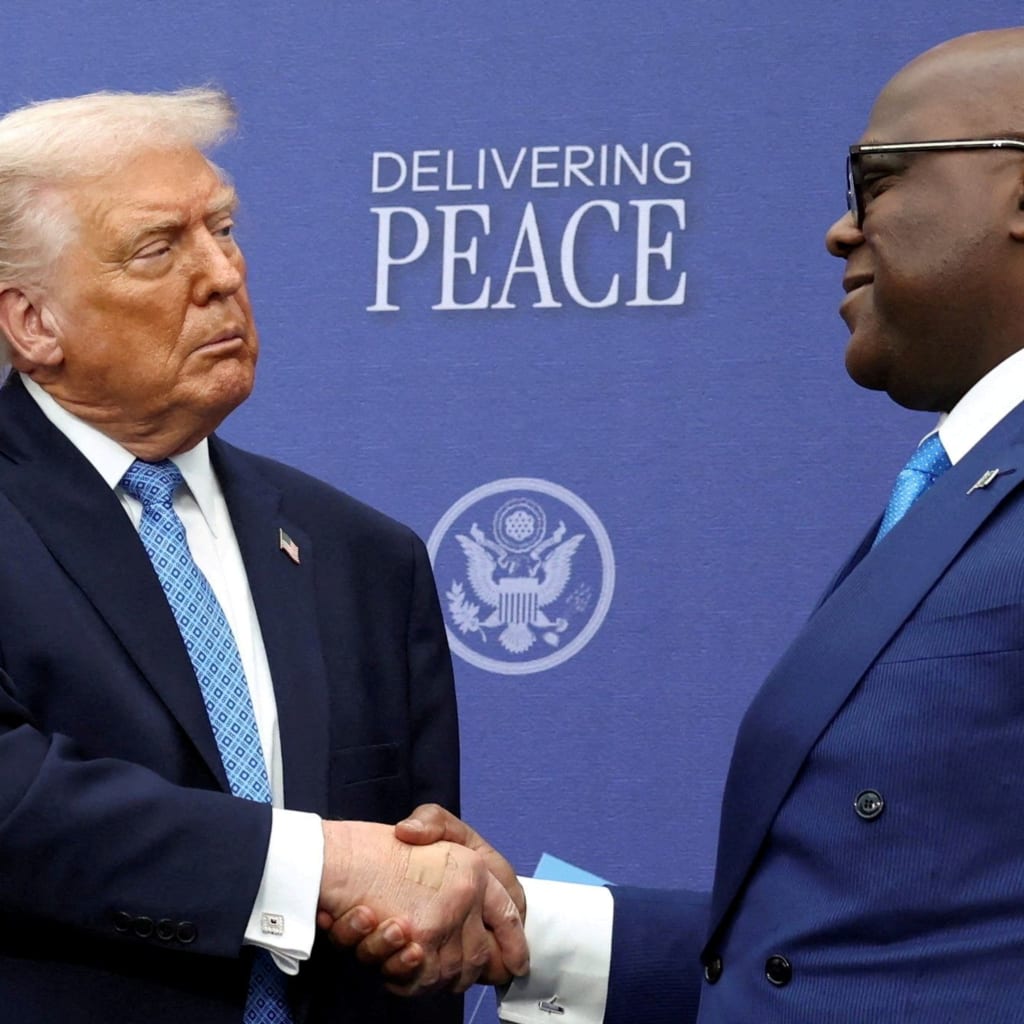 President Donald Trump shakes hands with President Felix Tshisekedi during a signing ceremony in Washington, D.C. on December 4, 2025.