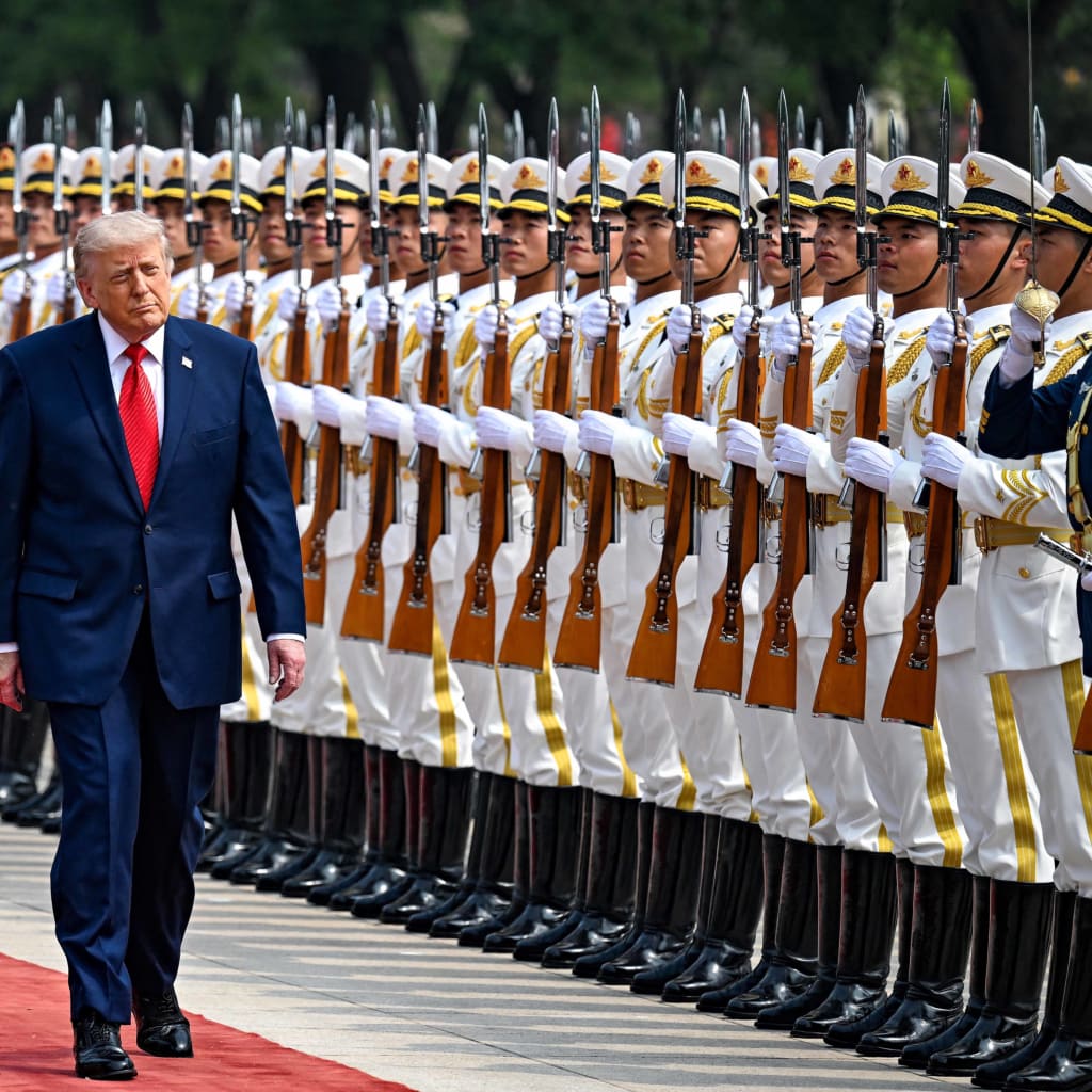 U.S. President Donald Trump reviews the troops with the President of the People’s Republic of China Xi Jinping, in Beijing, China