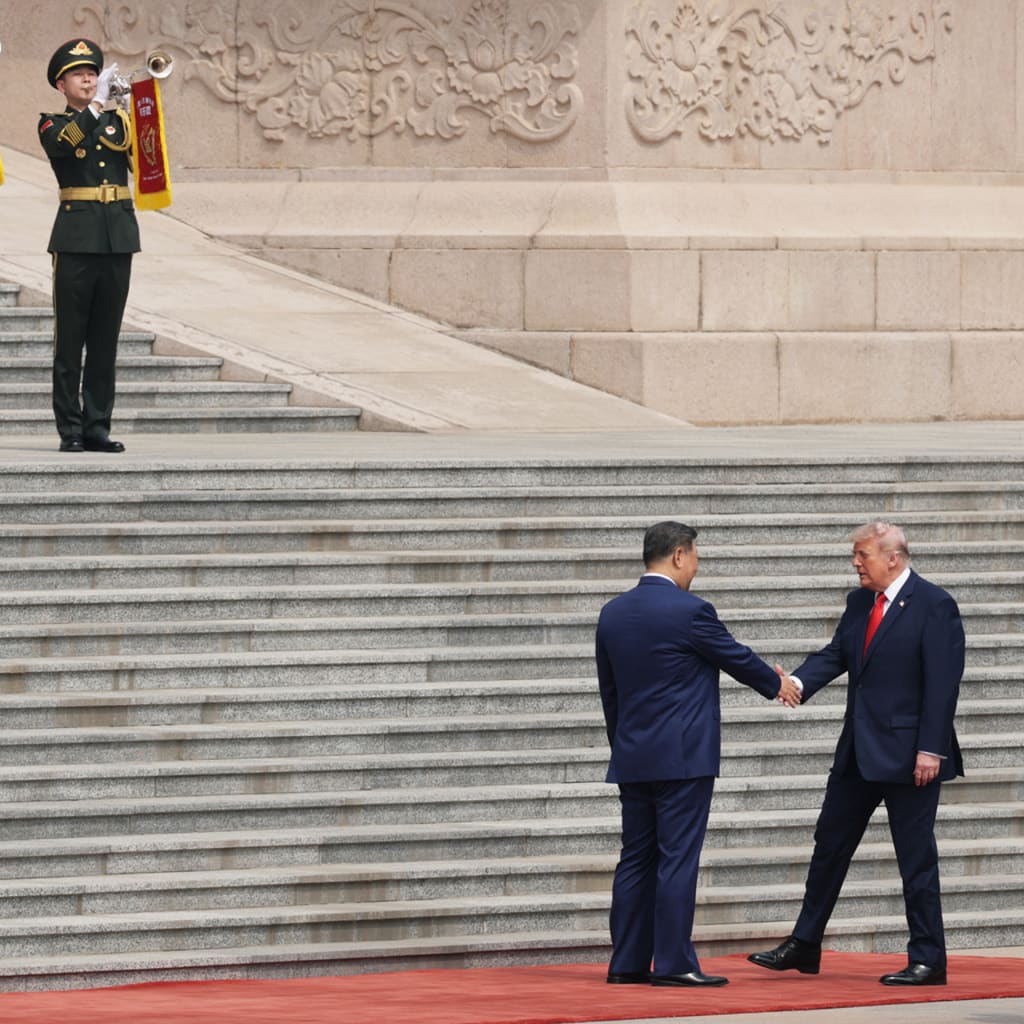 <p>U.S. President Donald Trump is greeted by Chinese President Xi Jinping during a welcome ceremony on May 14, 2026, in Beijing, China.</p>
