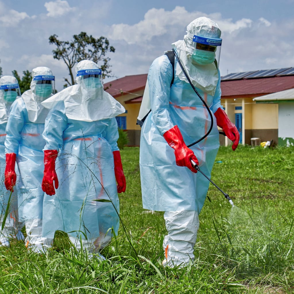 <p>Red Cross workers disinfect Rwampara General Hospital before handling the body of a person who died of Ebola, in Ituri province, Democratic Republic of Congo, on May 21, 2026.</p>

