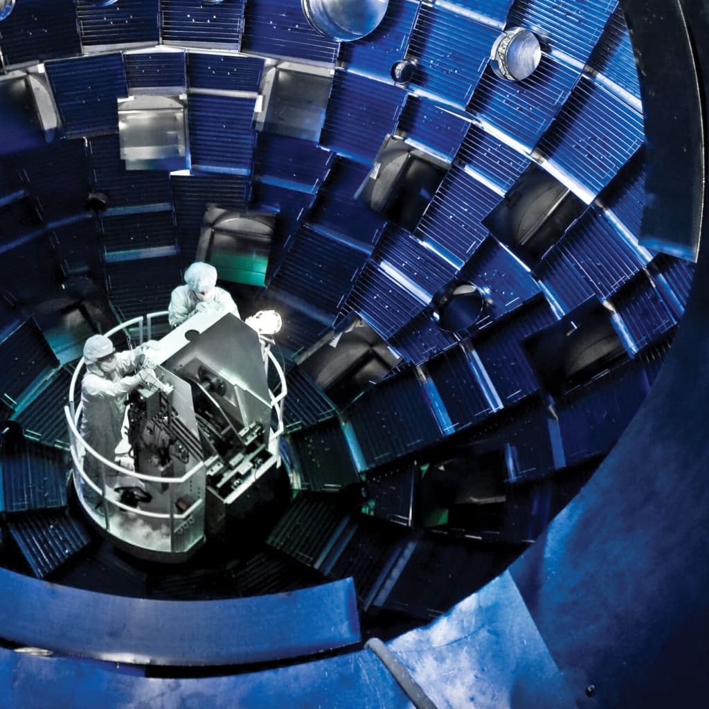 Technicians use a service system lift at Lawrence Livermore National Laboratory.