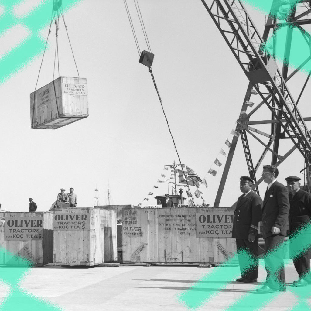 Crates of tractors are unloaded on docks after the first shipment of Marshall Plan industrial equipment reaches Istanbul.