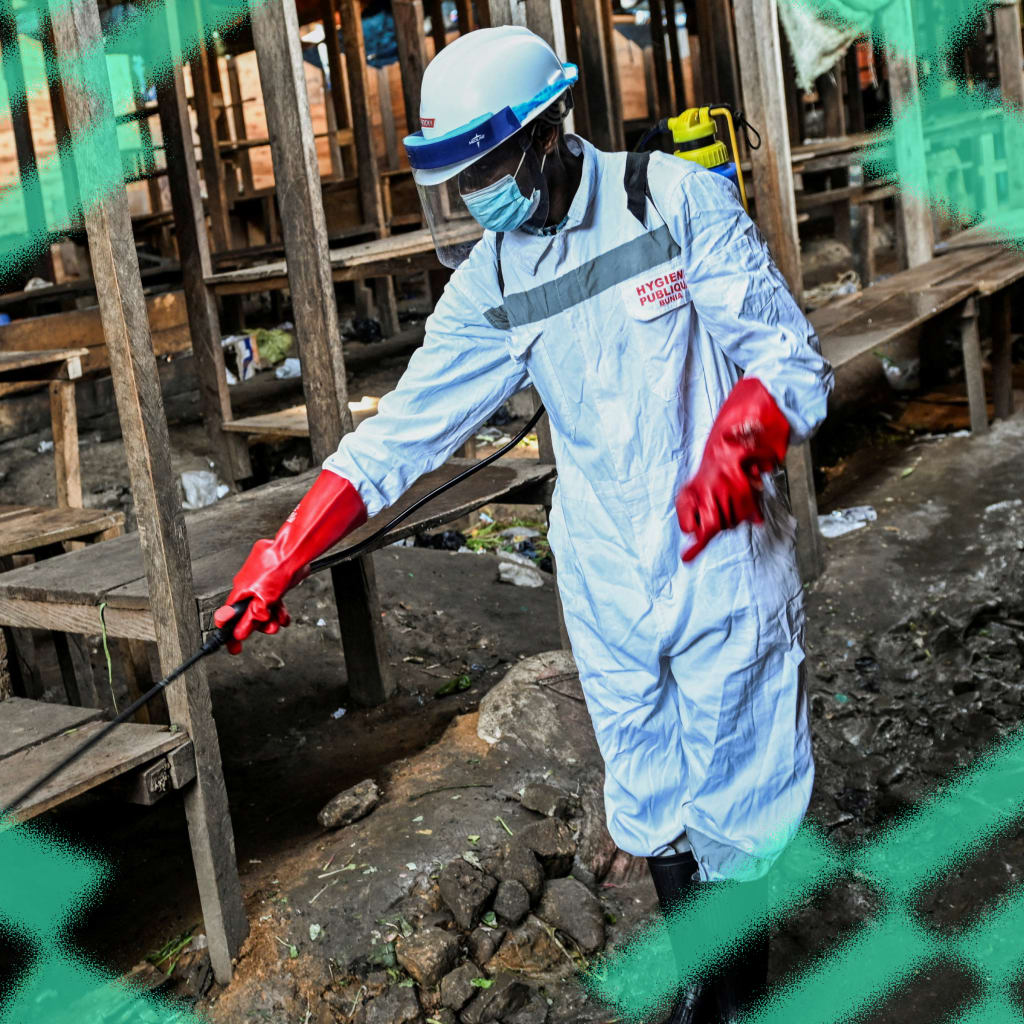 A sanitation worker from the Bunia city government sprays chlorine at the central market to limit the risk of the spread of the Ebola virus, in Ituri province, Democratic Republic of Congo, on May 23, 2026.