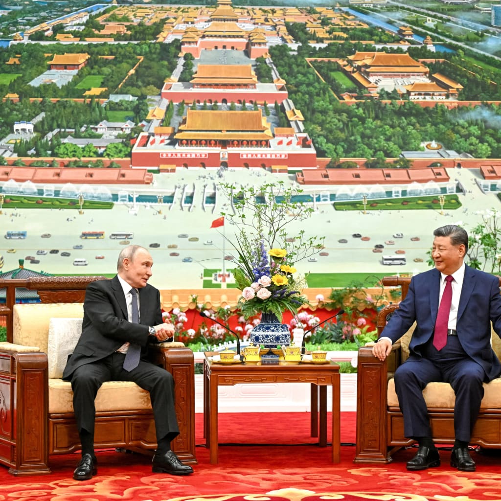 Russian President Vladimir Putin and Chinese President Xi Jinping have tea following their meeting at the Great Hall of the People in Beijing, China May 20, 2026. Sputnik/Kristina Solovyova/Pool via REUTERS