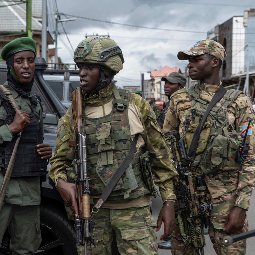 Members of the March 23 Movement rebel group attend the April 2025 opening ceremony of a bank that had been closed since the group’s takeover of Goma, Democratic Republic of Congo, in January 2025.