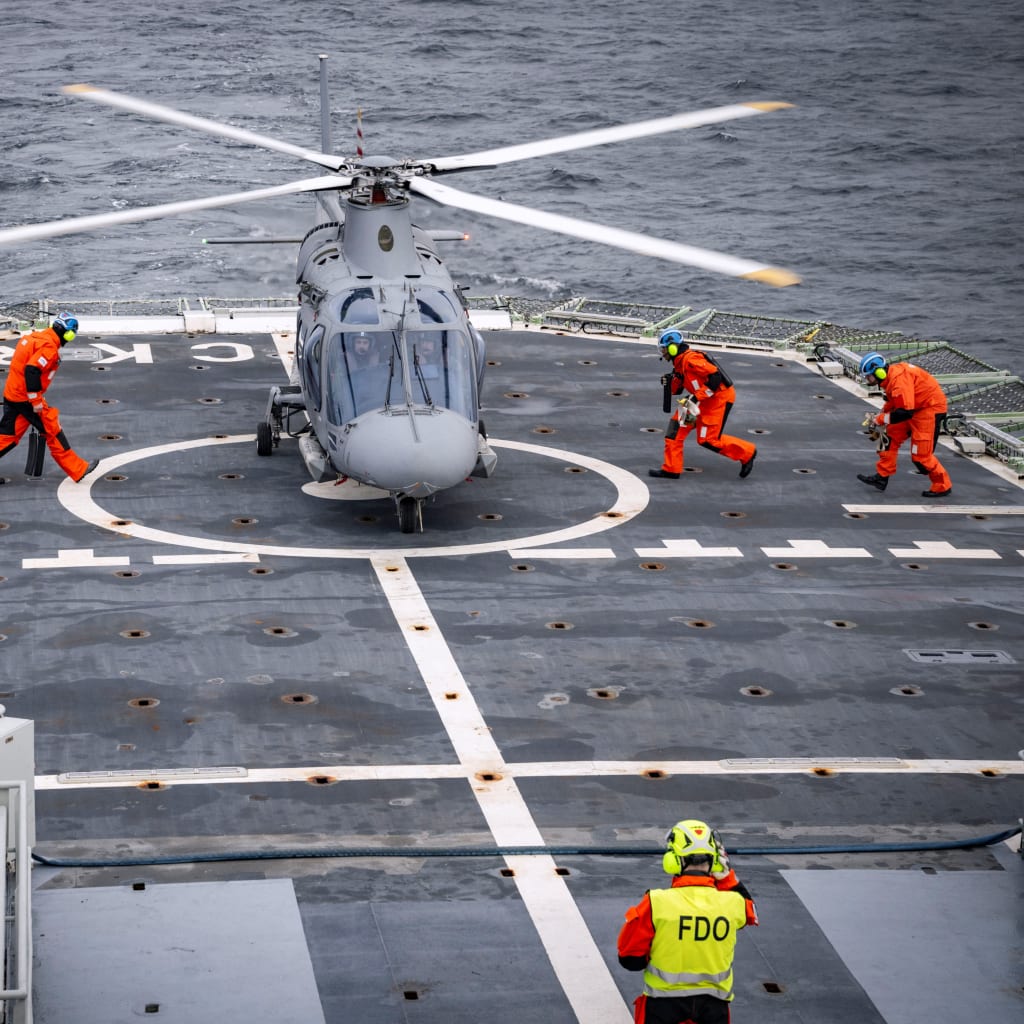 A helicopter lands on the flight deck of the patrol ship HSwMS Carlskrona after it set sail to join NATO’s Operation Baltic Sentry on February 4, 2025.