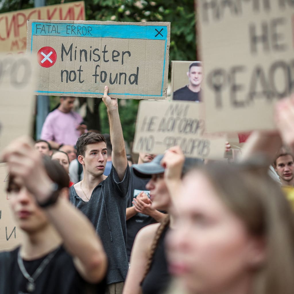 Participants hold signs during a rally to protest against Ukrainian President Volodymyr Zelenskyy's decision to replace Mykhailo Fedorov as Defense Minister, amid Russia's attack on Ukraine, in Kyiv, Ukraine, on July 24, 2026.
