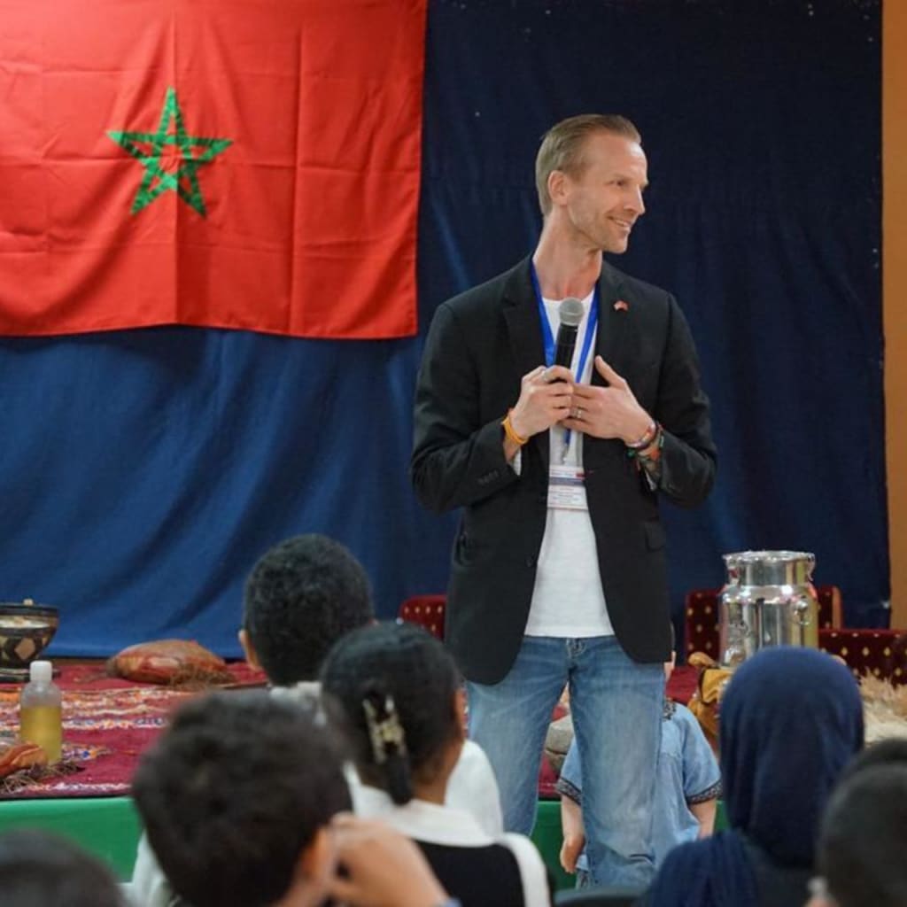 <p>Zachary Ritland (Braintree High School, MA) speaks to Moroccan classroom during his Fulbright Teachers for Global Classrooms trip.</p>