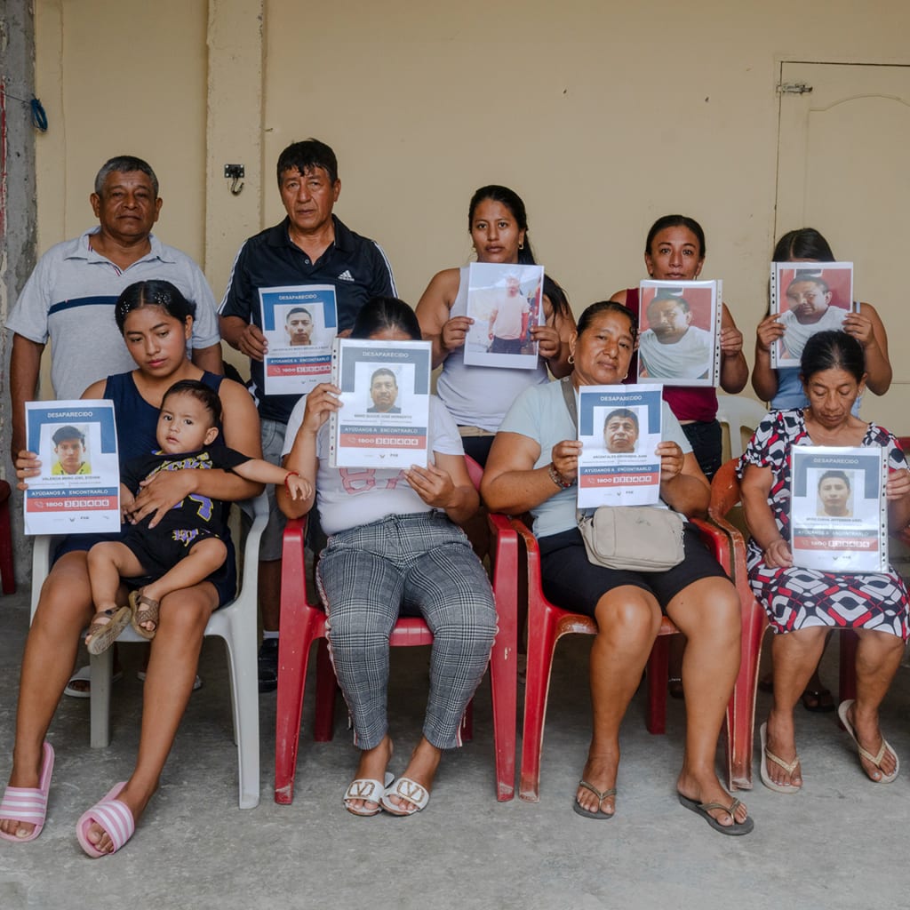 Mothers and relatives of missing fishermen from the vessel Fiorella pose for a portrait inside a family home in Jaramijó, Ecuador, one of the country's most important fishing ports along the Pacific coast, on Sunday, June 7, 2026.
