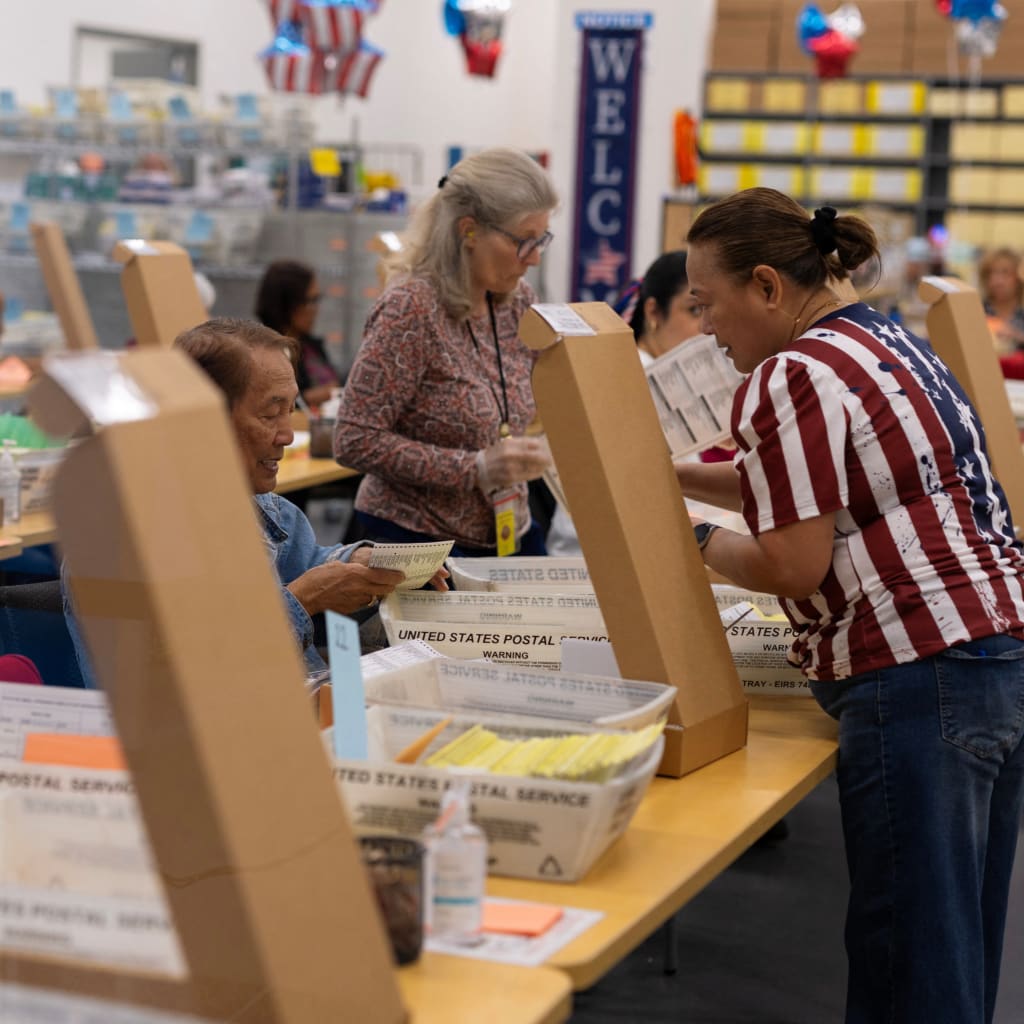 <p>Election workers extract mail-in ballots at the registrar of voters’ office during the California primary election in San Diego, California, June 2, 2026.</p>
