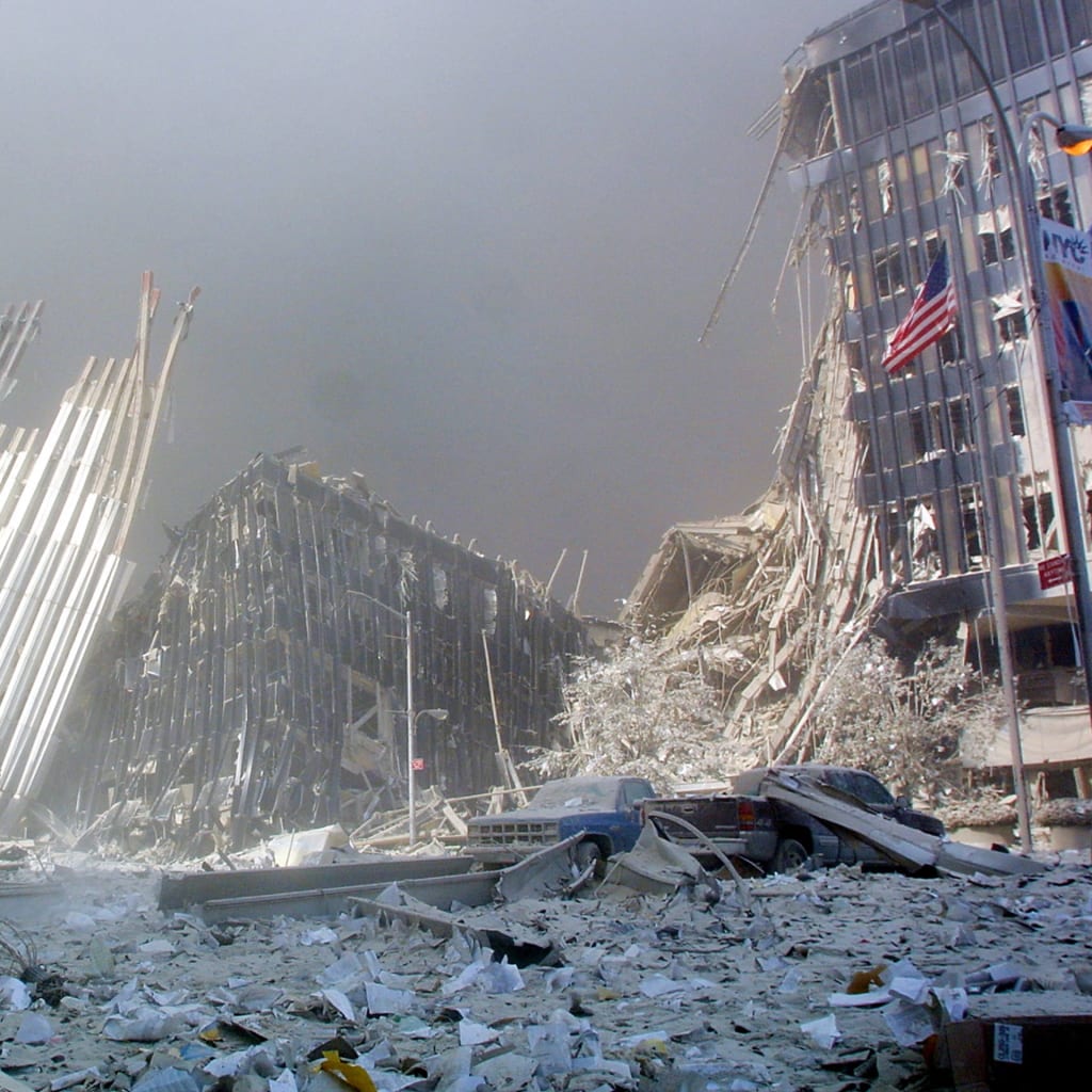 <p>A man calls out asking if anyone needs help after the collapse of the first World Trade Center Tower in New York City, on September, 11, 2001.</p>