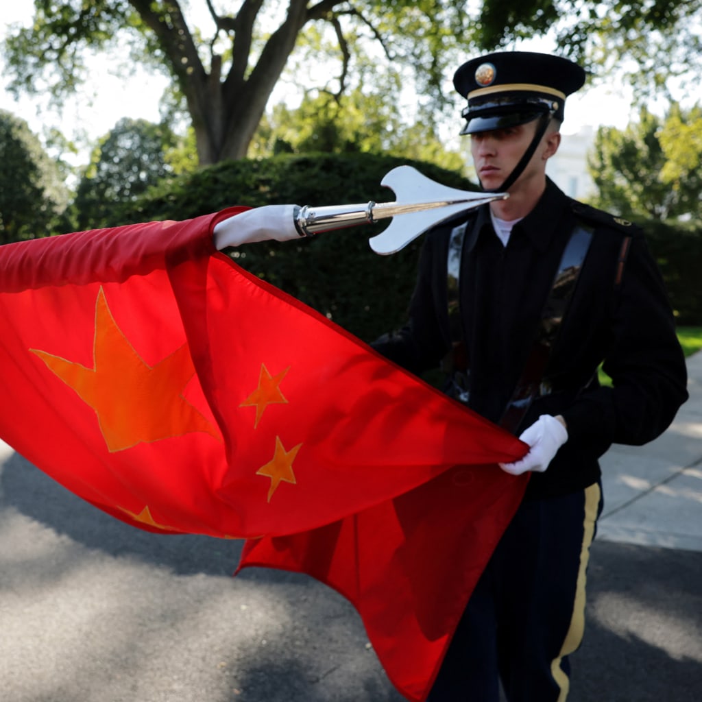 <p>Members of a U.S. military honor guard roll up a Chinese flag after rehearsing for Chinese leader Xi Jinping’s state visit to Washington, DC, September 16, 2026.</p>