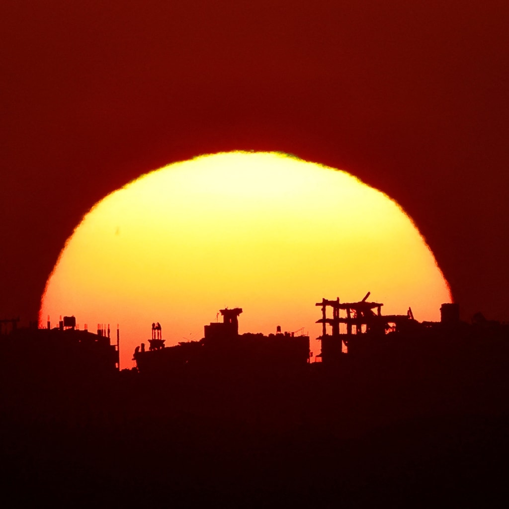 <p>The sun sets over Gaza, as seen from the Israeli side of the border, on September 1, 2026.</p>
