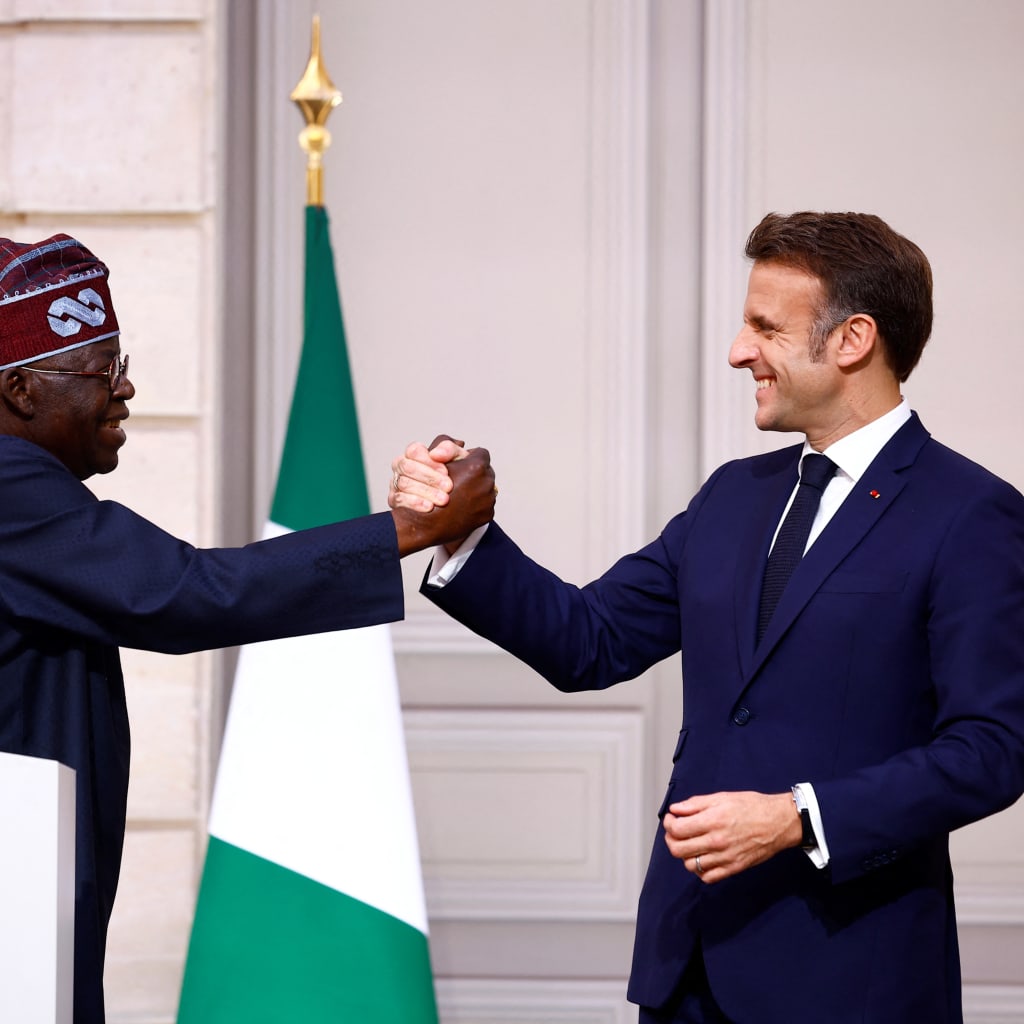 <p>French President Emmanuel Macron shakes hands with Nigerian President Bola Ahmed Tinubu after they delivered statements to the press following a meeting at the Elysee Palace in Paris as part of his two-day state visit to France, on November 28, 2024.</p>
