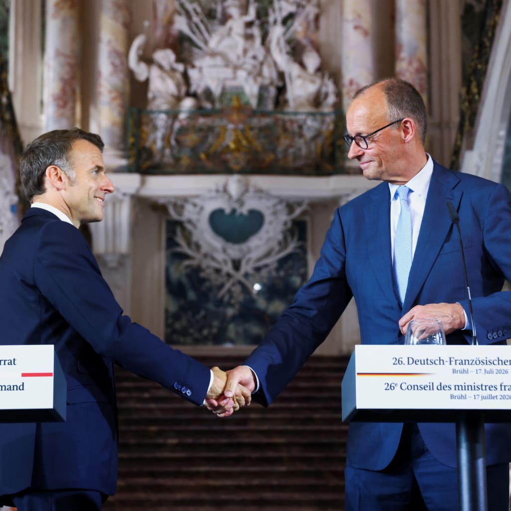 <p>French President Emmanuel Macron and German Chancellor Friedrich Merz shake hands after a press conference at Schloss Augustusburg in Bruehl, Germany, on July 17, 2026.</p>

