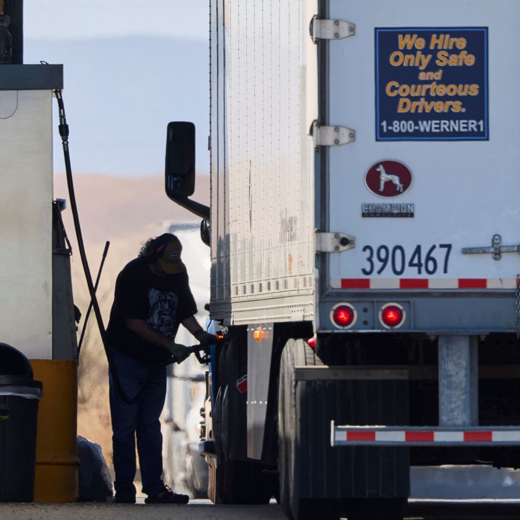 A driver fills his semi with diesel at a truck stop in Dunnigan, California, September 28, 2026.