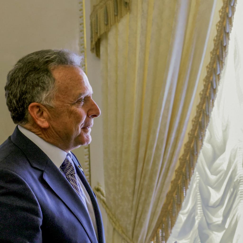 In this pool photograph distributed by the Russian state agency Sputnik, Russia's President Vladimir Putin greets US special envoy Steve Witkoff during their meeting in Saint Petersburg on October 21, 2026.