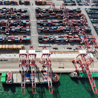 <p>A drone view shows ships and containers at the port in Qingdao, Shandong province, China October 20, 2025.</p>