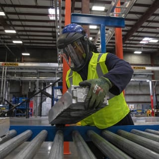 <p>A technician places electric vehicle batteries on a conveyer belt at the Ascend Elements electric vehicle recycling plant in Covington, Georgia, March 31, 2023. </p>