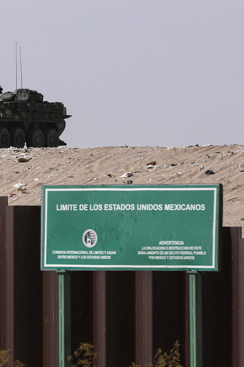 <p>A vehicle patrols near a sign reading “United States of Mexico limits” in New Mexico.</p>
