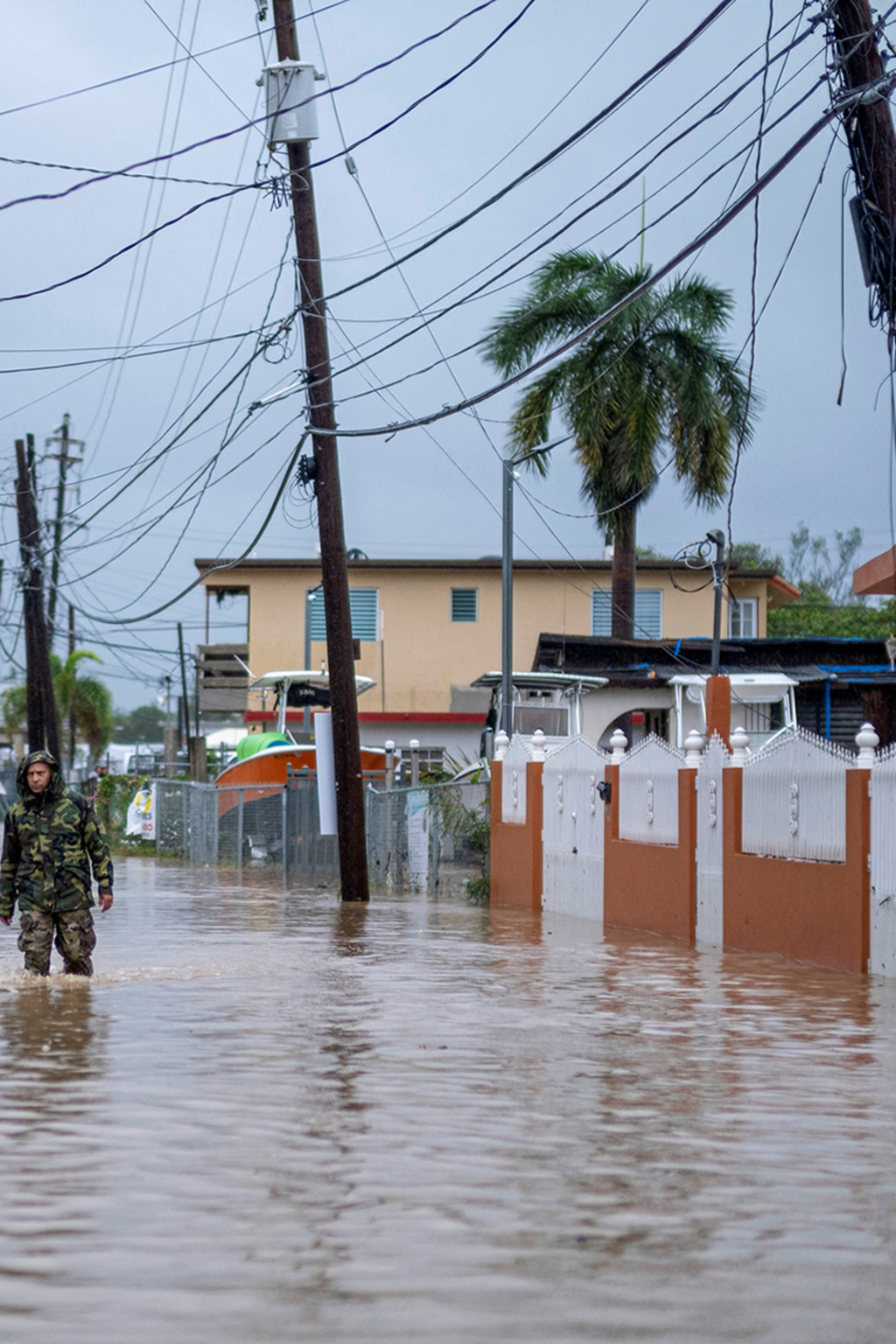<p>A member of the Puerto Rican National Guard searches for people in the wake of Hurricane Fiona.</p>
