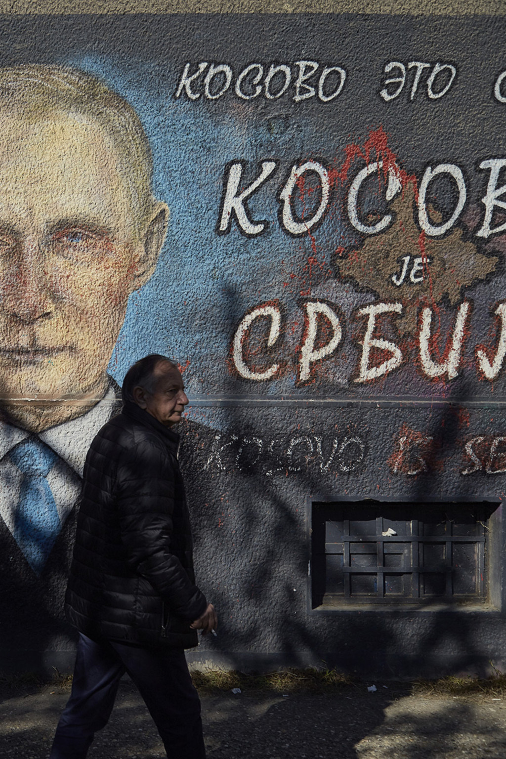 <p>A mural in Belgrade depicts Russian President Vladimir Putin and a text reading “Kosovo is Serbia.”</p>
