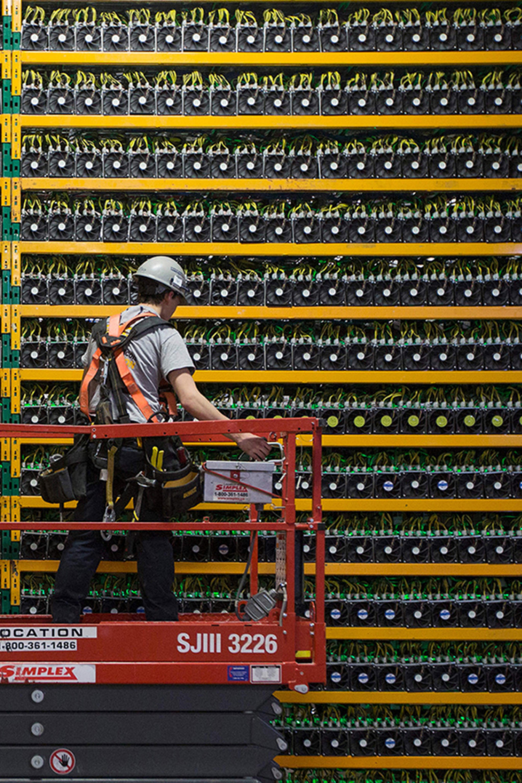 <p>A technician inspects a Bitcoin mining operation in Quebec, Canada.</p>
