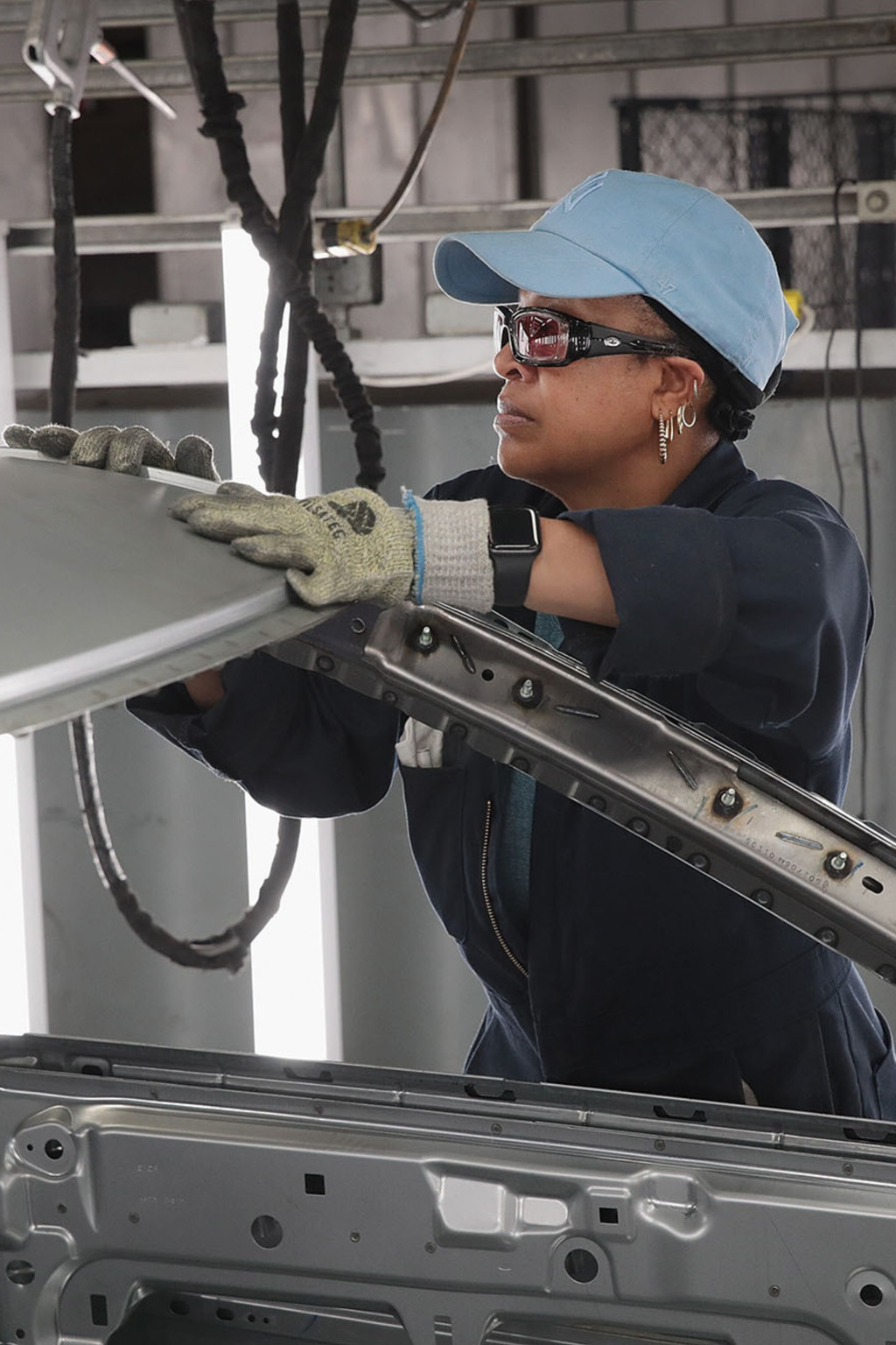 <p>Workers assemble Ford vehicles at a plant in Chicago, Illinois.</p>
