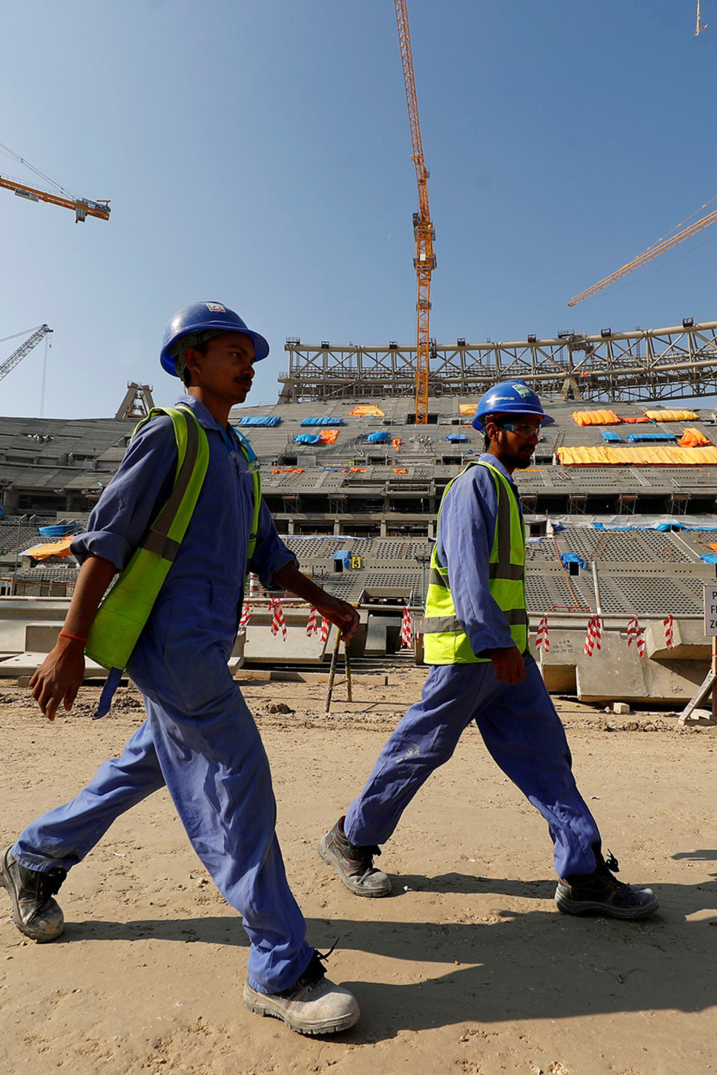 <p>Workers construct the Lusail National Stadium for the 2022 FIFA World Cup in Doha, Qatar.</p>
