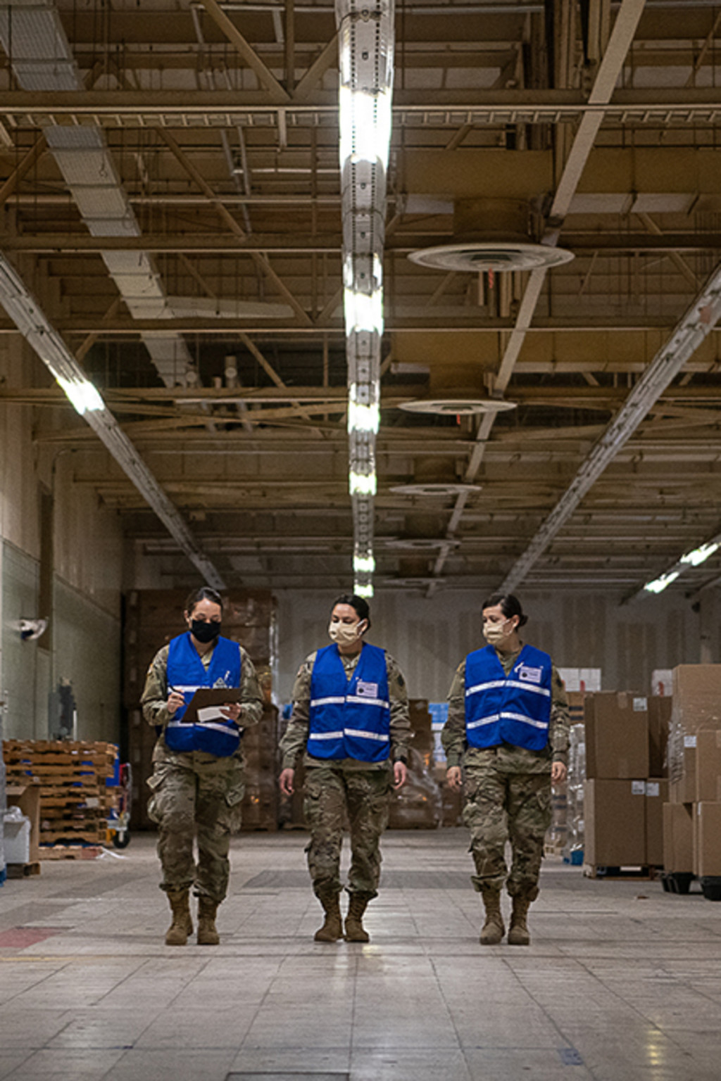 <p>Members of the Oklahoma National Guard walk in the Strategic National Stockpile Warehouse.</p>
