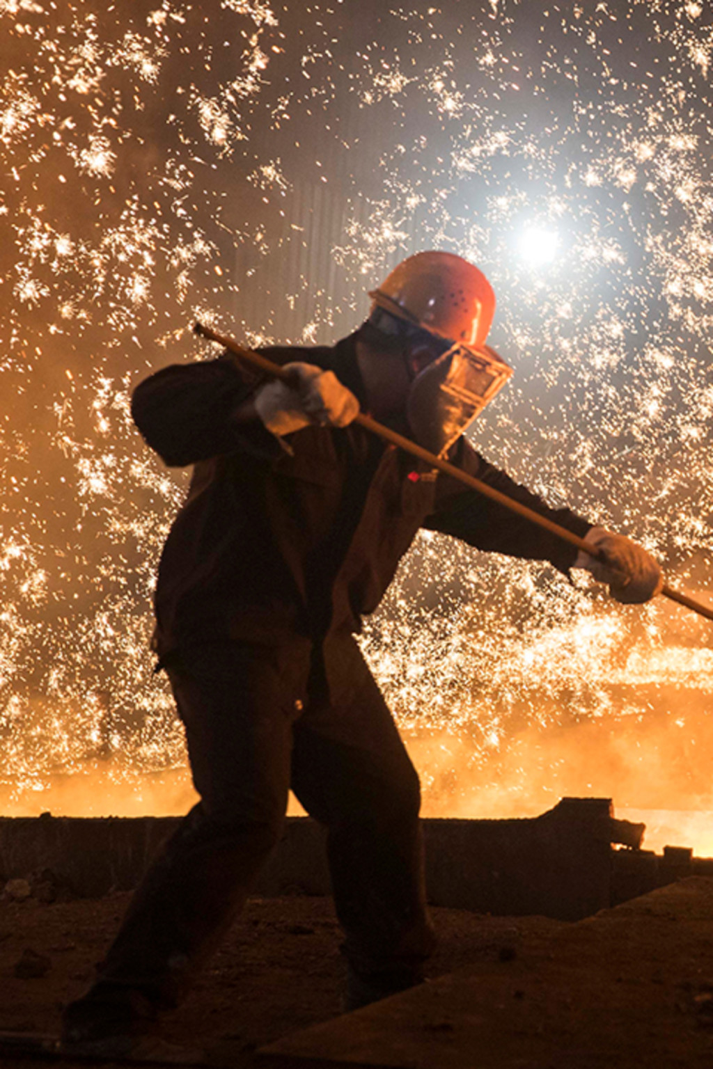 <p>Workers at a steel plant in Shandong province, China, in July 2017.</p>
