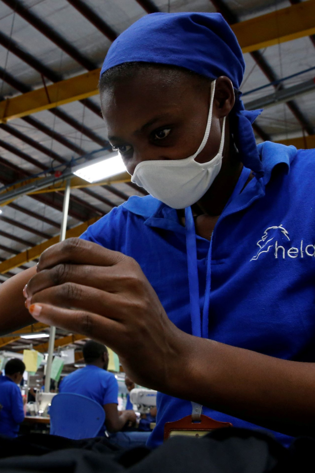 <p>A worker sews at an export processing zone factory in Athi River, Kenya.</p>
