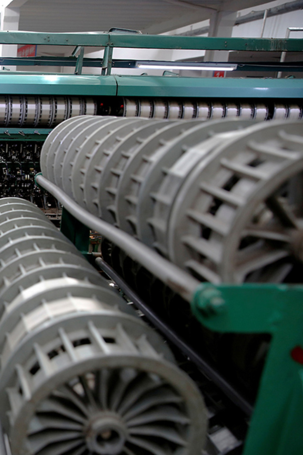 <p>A woman works at a textile mill in Pyongyang, North Korea. </p>
