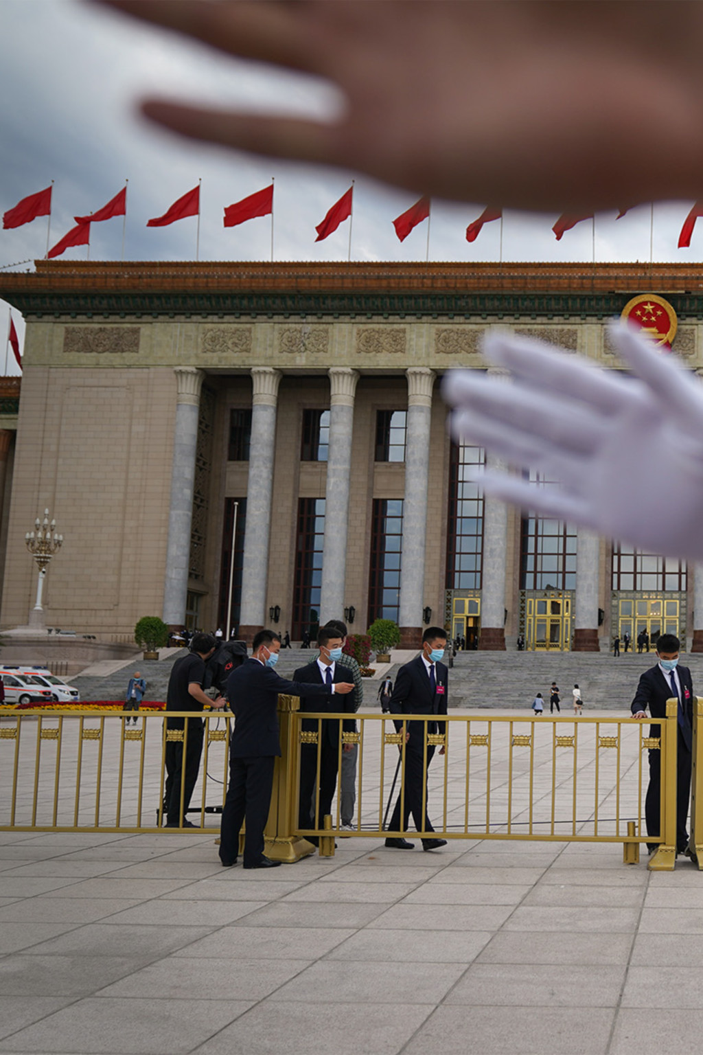 <p>Security guards block a journalist from taking photos in Beijing’s Tiananmen Square.</p>
