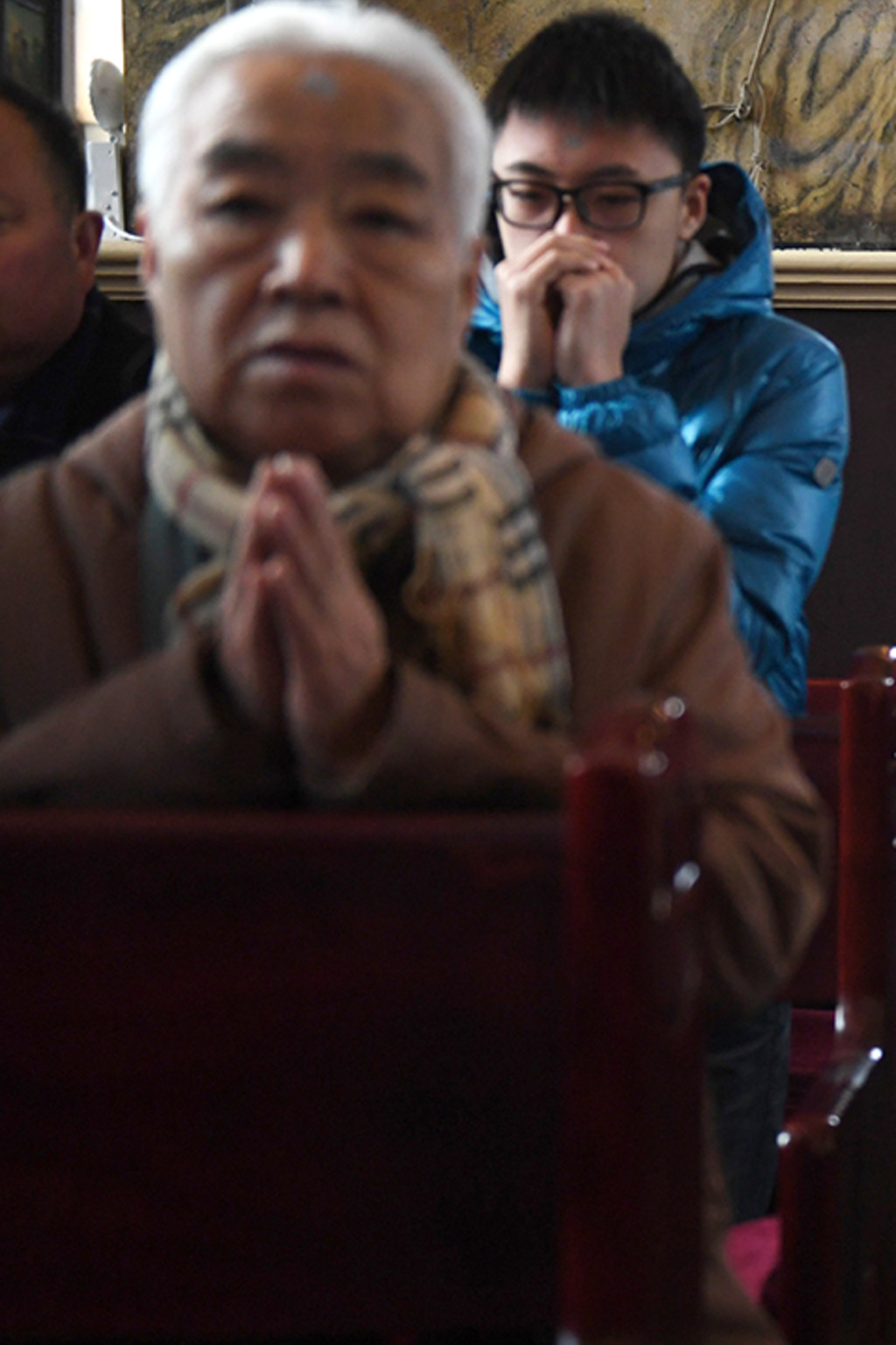 <p>Chinese Catholics attend an Ash Wednesday mass at a state-sanctioned church in Beijing.</p>