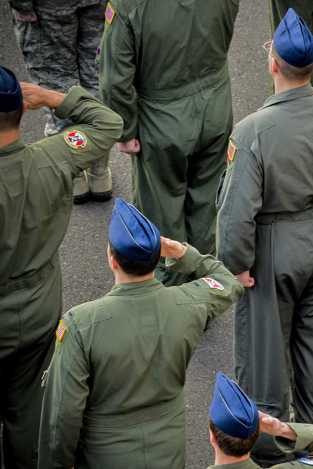 <p>Members of the U.S. Air Force salute during a ceremony at Yokota Air Base, Japan. </p>
