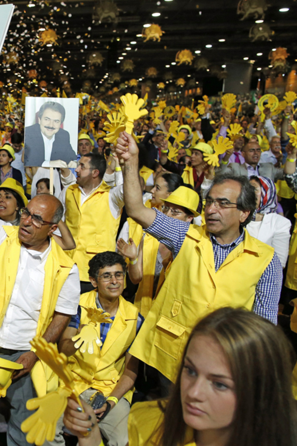 <p>Supporters of Maryam Rajavi, president-elect of the National Council of Resistance of Iran, take part in a rally near Paris, June 2014. </p>
