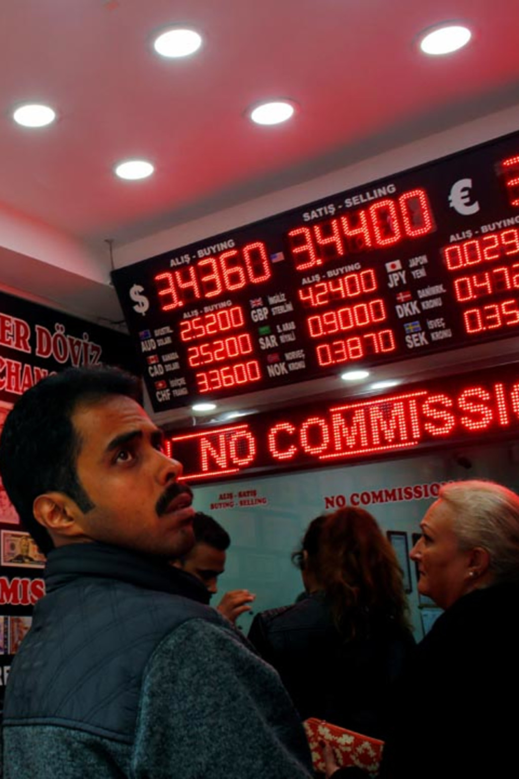 <p>Exchange rates on display at a currency exchange office in Istanbul, Turkey.</p>